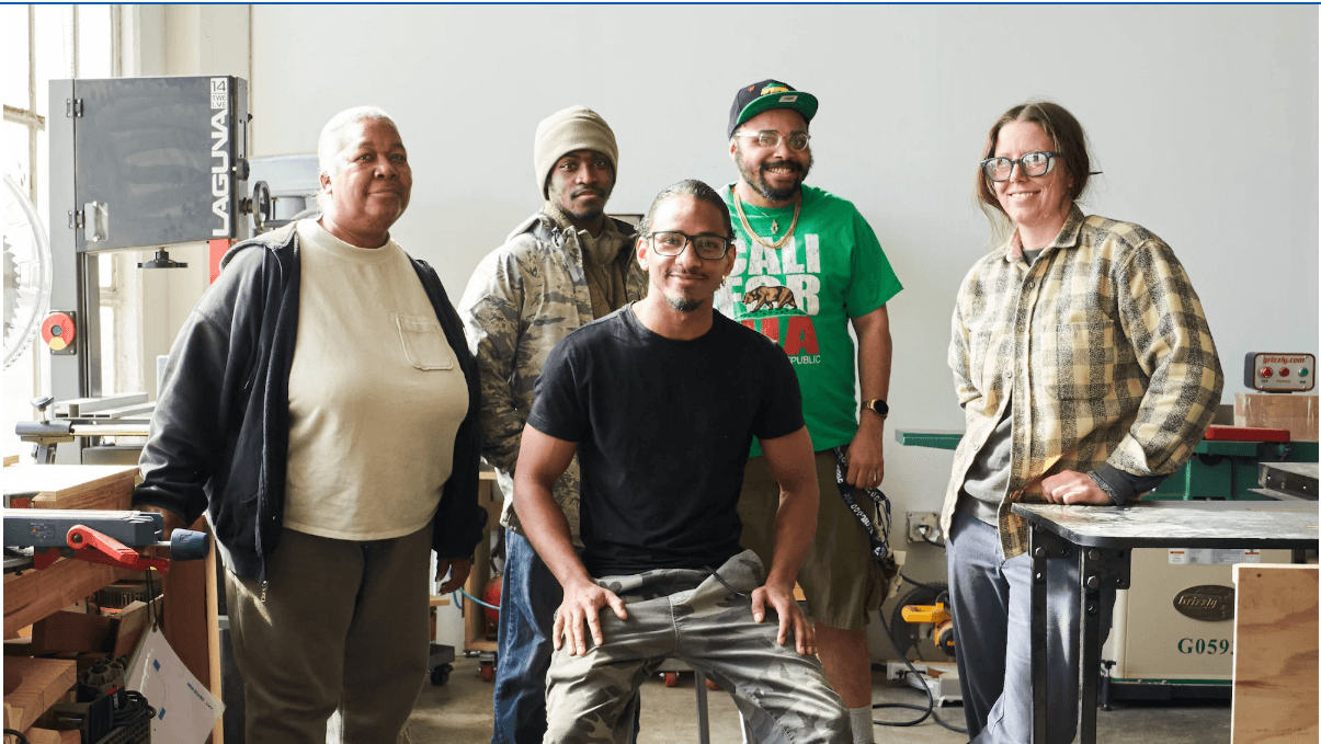 Owners and crew of an Ohio fabrication shop on their shop floor